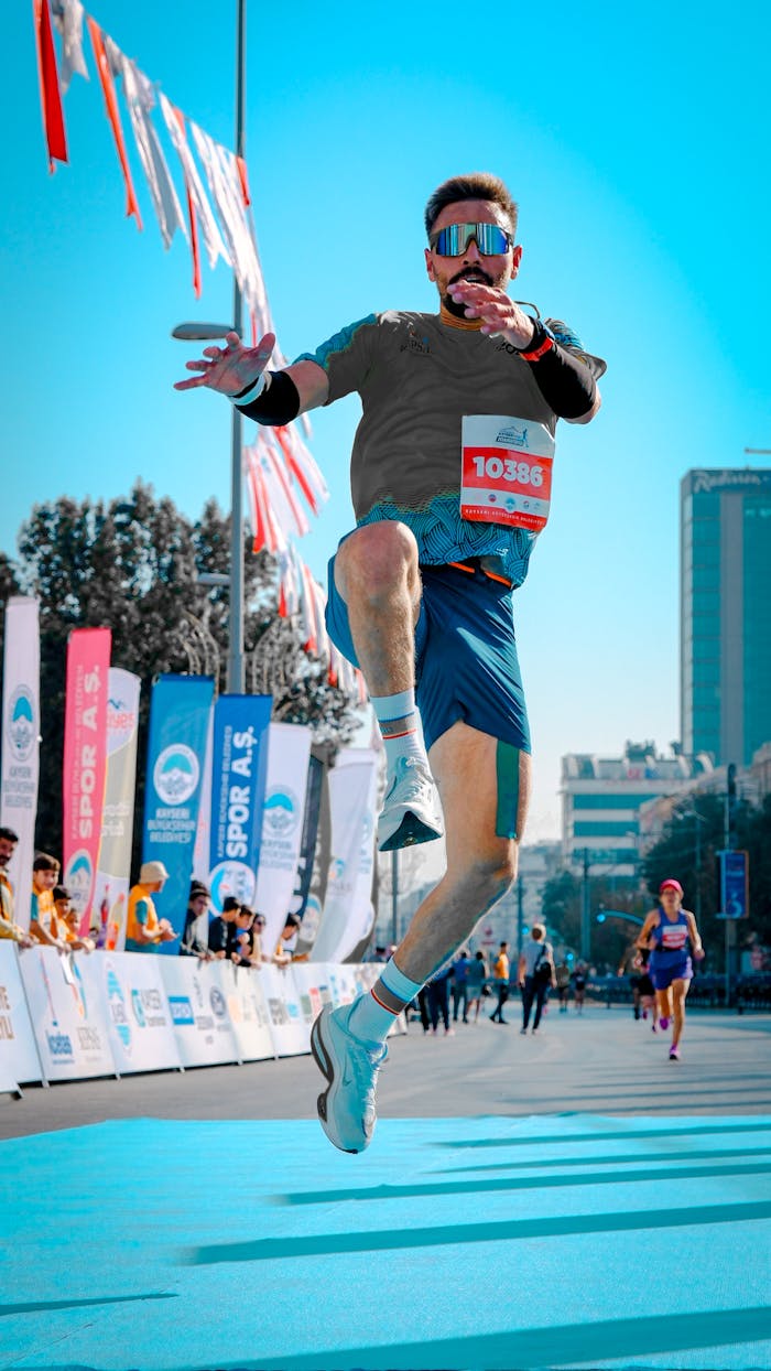 A Man Jumping at a Marathon 